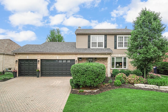 12533 Rosewood Dr, Homer Glen, IL 60491 - view of front of property with an attached garage, decorative driveway, brick siding, a front yard, and a chimney