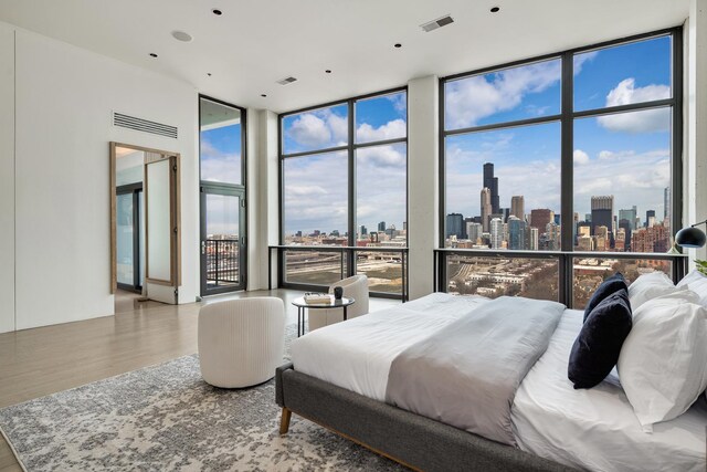 1530 S State St Unit 18A-B, Chicago, IL 60605 - bedroom featuring a skyline view, wood finished floors, and floor to ceiling windows
