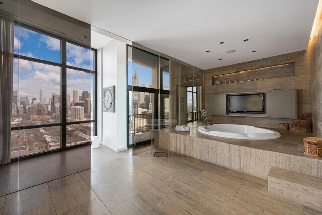 1530 S State St Unit 18A-B, Chicago, IL 60605 - bathroom featuring a garden tub, floor to ceiling windows, and a view of skyline