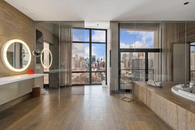 1530 S State St Unit 18A-B, Chicago, IL 60605 - full bath featuring floor to ceiling windows, vanity, a view of skyline, and a garden tub