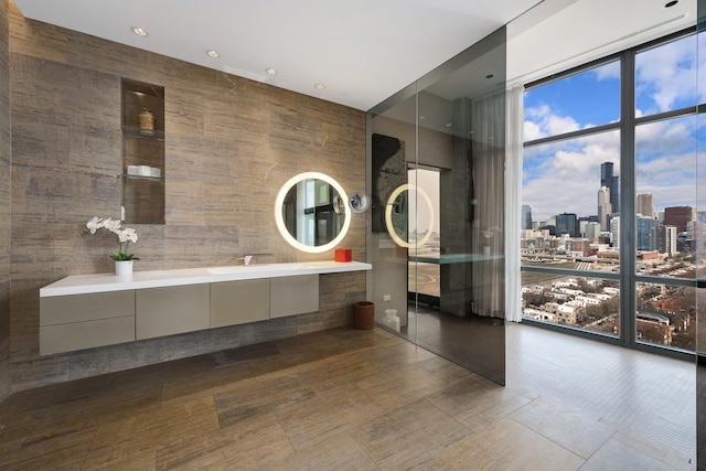 1530 S State St Unit 18A-B, Chicago, IL 60605 - bathroom featuring a skyline view, double vanity, and expansive windows