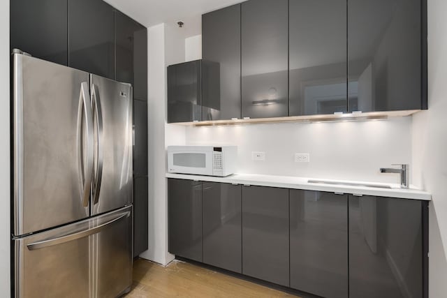 1530 S State St Unit 18A-B, Chicago, IL 60605 - kitchen with freestanding refrigerator, white microwave, modern cabinets, gray cabinetry, and a sink