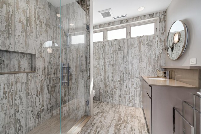 1530 S State St Unit 18A-B, Chicago, IL 60605 - full bathroom featuring vanity, a shower stall, toilet, and tile walls