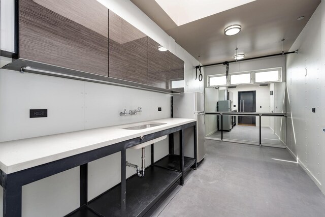 1530 S State St Unit 18A-B, Chicago, IL 60605 - kitchen featuring a sink, freestanding refrigerator, concrete floors, baseboards, and light countertops