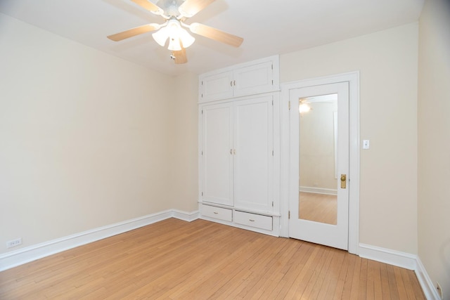 7631 N Eastlake Ter Unit 2C, Chicago, IL 60626 - unfurnished bedroom with light wood-style flooring, baseboards, a ceiling fan, and a closet