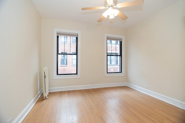 7631 N Eastlake Ter Unit 2C, Chicago, IL 60626 - spare room featuring light wood finished floors, baseboards, and ceiling fan
