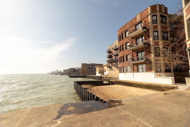 7631 N Eastlake Ter Unit 2C, Chicago, IL 60626 - view of apartment building / complex featuring a water view and a boat ramp