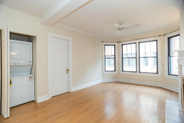 7631 N Eastlake Ter Unit 2C, Chicago, IL 60626 - unfurnished room with stacked washer / drying machine, a ceiling fan, light wood-style flooring, baseboards, and crown molding