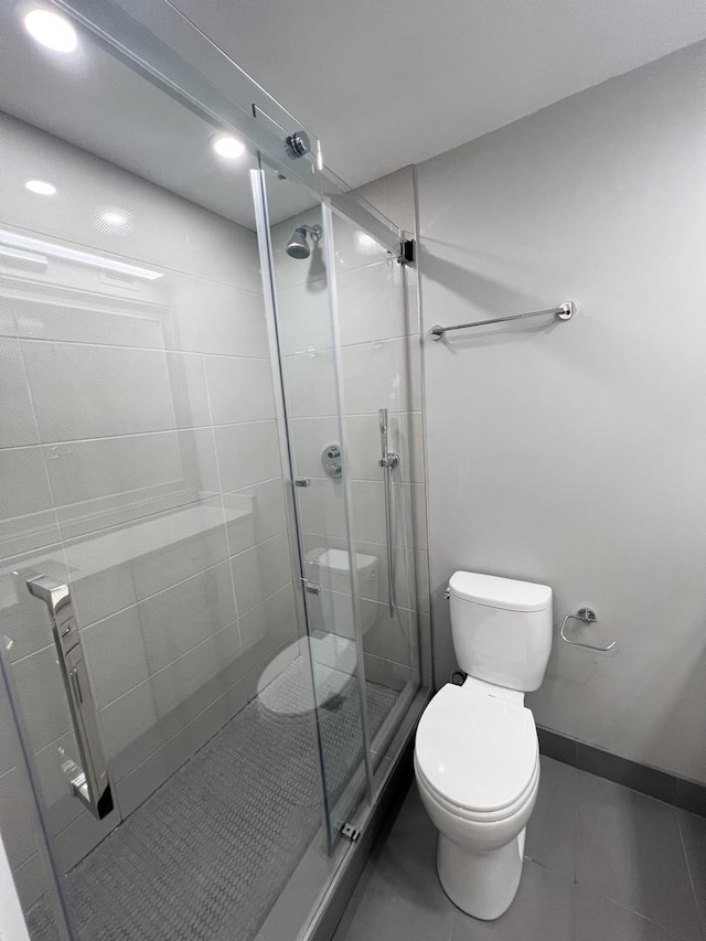 2020 N Lincoln Park W Unit 30L, Chicago, IL 60614 - full bath with toilet, a stall shower, tile patterned flooring, and recessed lighting