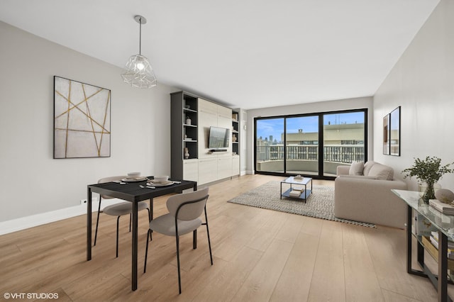 2020 N Lincoln Park W Unit 30L, Chicago, IL 60614 - dining room featuring light wood-type flooring and baseboards