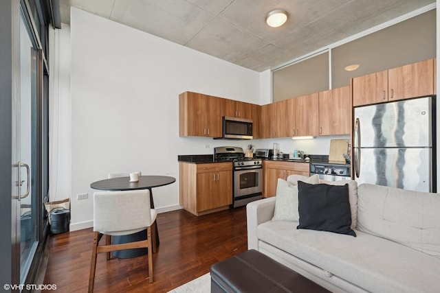 235 W Van Buren St Unit 3419, Chicago, IL 60607 - kitchen featuring stainless steel appliances, dark countertops, and dark wood finished floors
