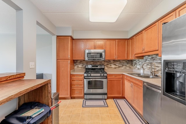 390 S Western Ave Unit 504, Des Plaines, IL 60016 - kitchen with appliances with stainless steel finishes, tasteful backsplash, and light countertops