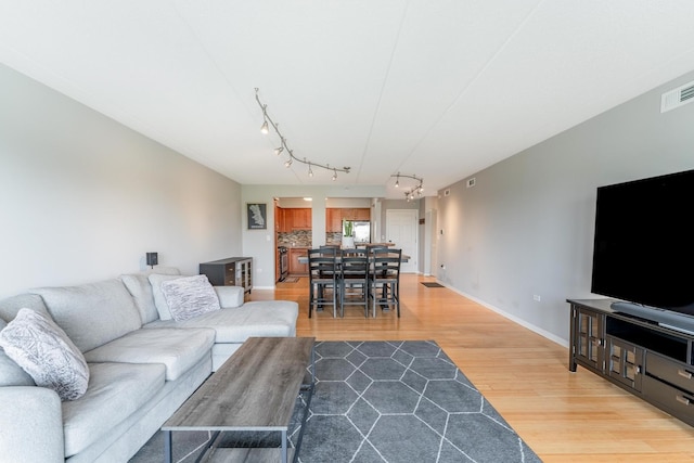 390 S Western Ave Unit 504, Des Plaines, IL 60016 - living room featuring track lighting and light wood finished floors