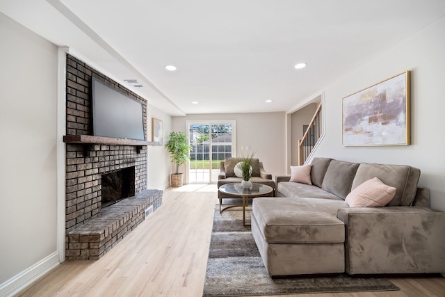 791 N Michigan St, Elmhurst, IL 60126 - living room featuring wood finished floors, a fireplace, stairs, baseboards, and recessed lighting