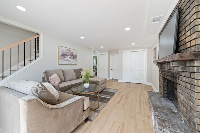 791 N Michigan St, Elmhurst, IL 60126 - living area featuring a brick fireplace, wood finished floors, stairway, recessed lighting, and baseboards