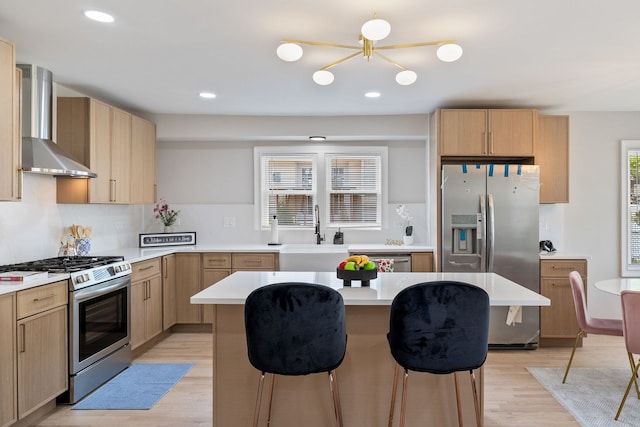 791 N Michigan St, Elmhurst, IL 60126 - kitchen with appliances with stainless steel finishes, wall chimney range hood, a sink, light brown cabinets, and recessed lighting