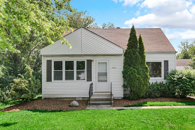 20801 Western Ave, Chicago Heights, IL 60411 - view of front of house with a front yard, entry steps, and a shingled roof
