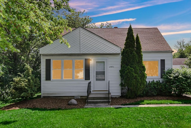 20801 Western Ave, Chicago Heights, IL 60411 - view of front of property with a lawn, entry steps, and a shingled roof