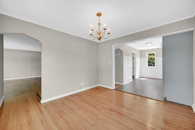 20801 Western Ave, Chicago Heights, IL 60411 - spare room with a chandelier, ornamental molding, and wood-type flooring