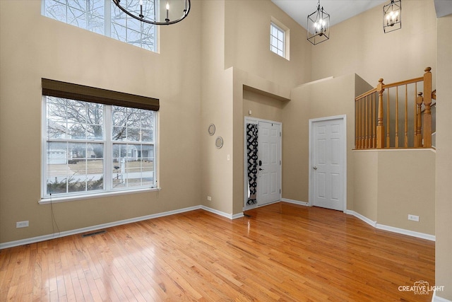 2539 Lexington Ln, Naperville, IL 60540 - foyer entrance featuring a chandelier, hardwood / wood-style flooring, baseboards, and a high ceiling
