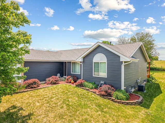 4306 Westridge Dr, Winnebago, IL 61088 - ranch-style house featuring a front lawn, central air condition unit, and a shingled roof
