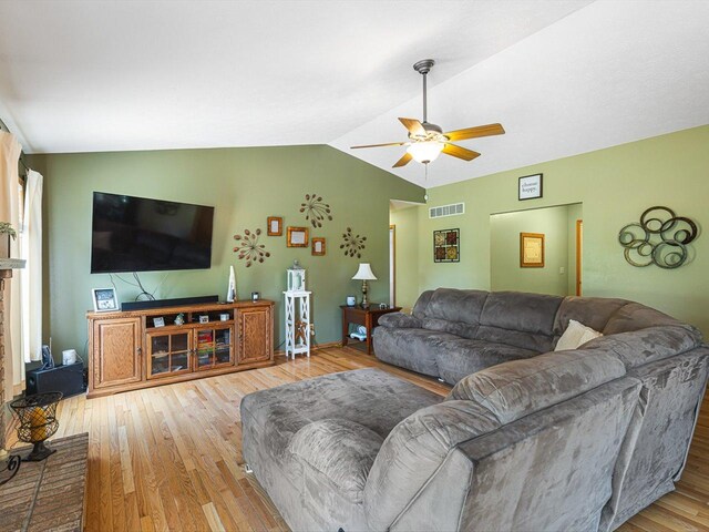 4306 Westridge Dr, Winnebago, IL 61088 - living area with lofted ceiling, a ceiling fan, wood finished floors, and baseboards
