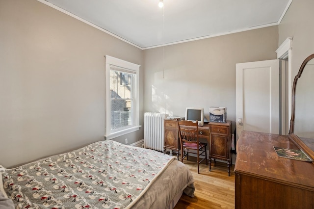 212 S Austin Blvd, Oak Park, IL 60304 - bedroom with crown molding, radiator, and wood finished floors
