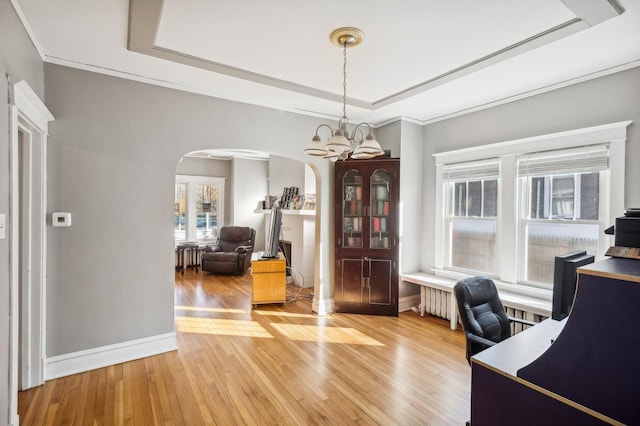 212 S Austin Blvd, Oak Park, IL 60304 - office featuring arched walkways, light wood-style floors, a raised ceiling, radiator heating unit, and ornamental molding