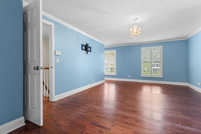 43 Kings Cross Dr, Lincolnshire, IL 60069 - spare room with a chandelier, ornamental molding, wood finished floors, and baseboards