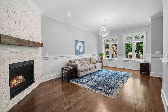 6336 S Kimbark Ave, Chicago, IL 60637 - living area featuring a stone fireplace, a chandelier, wood finished floors, crown molding, and recessed lighting