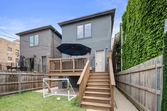 6336 S Kimbark Ave, Chicago, IL 60637 - rear view of house with a wooden deck and a fenced backyard