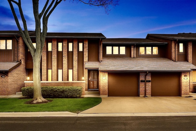 1226 Beau Dr, Park Ridge, IL 60068 - view of front of home featuring concrete driveway, a garage, and brick siding