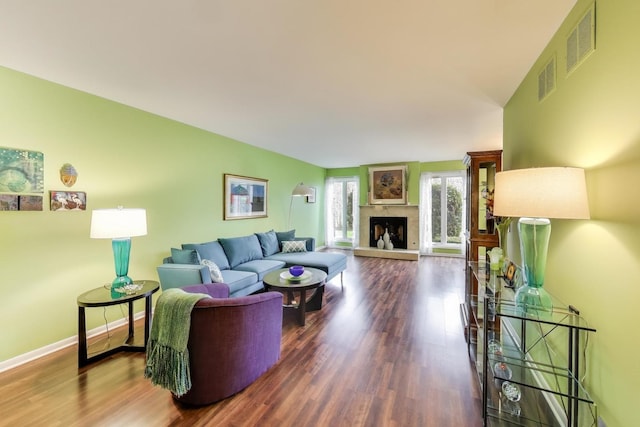1226 Beau Dr, Park Ridge, IL 60068 - living area with wood finished floors, baseboards, and a fireplace with raised hearth