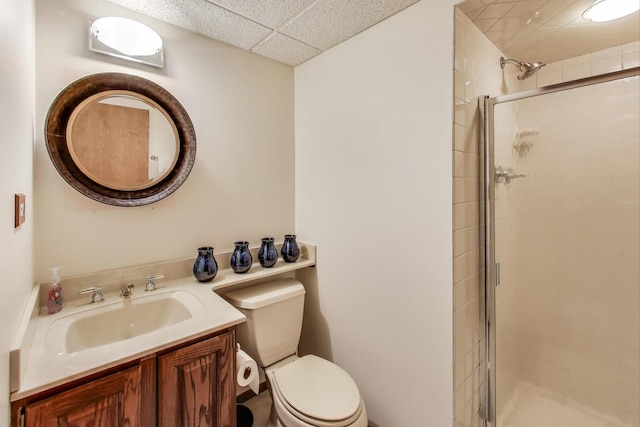 1226 Beau Dr, Park Ridge, IL 60068 - bathroom featuring a paneled ceiling, toilet, a stall shower, and vanity