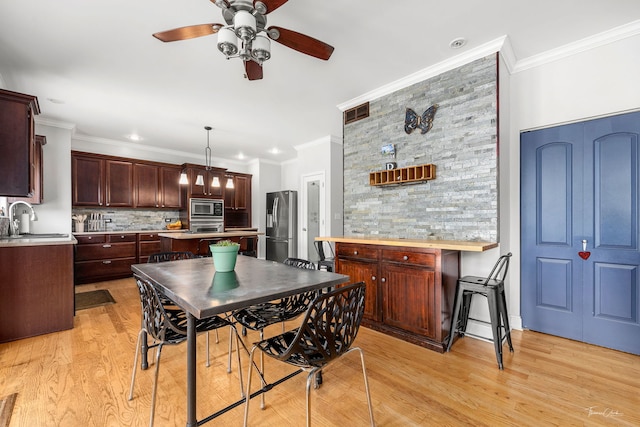 24147 S Sunset Dr, Channahon, IL 60410 - dining space with ceiling fan, light wood-style flooring, crown molding, and recessed lighting