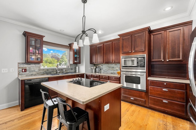 24147 S Sunset Dr, Channahon, IL 60410 - kitchen featuring black appliances, glass insert cabinets, light countertops, decorative backsplash, and crown molding