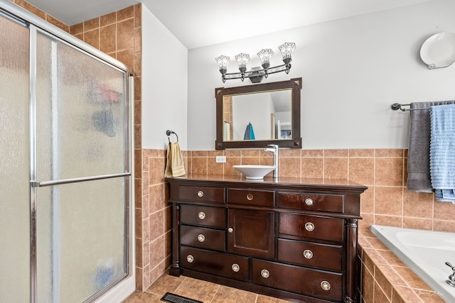 24147 S Sunset Dr, Channahon, IL 60410 - full bath featuring tile walls, a shower stall, vanity, a bath, and tile patterned flooring