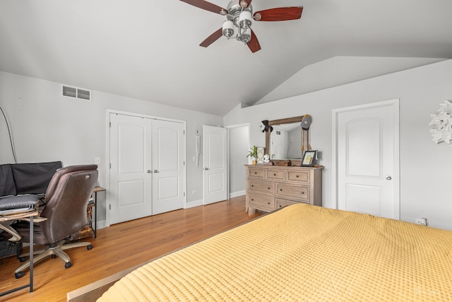 24147 S Sunset Dr, Channahon, IL 60410 - bedroom with vaulted ceiling, a closet, wood finished floors, and a ceiling fan
