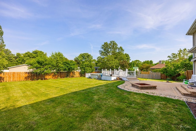 24147 S Sunset Dr, Channahon, IL 60410 - fenced backyard with a wooden deck and a patio