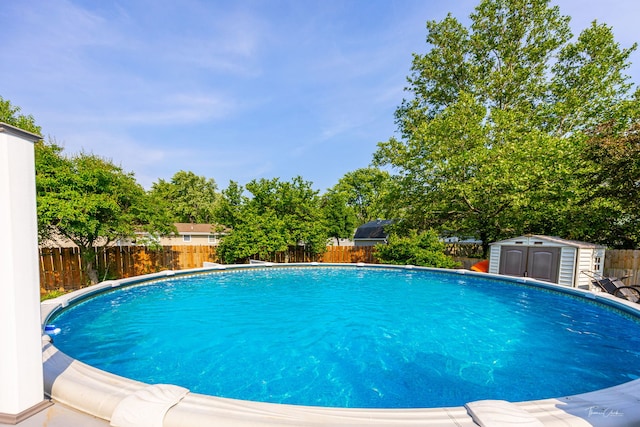 24147 S Sunset Dr, Channahon, IL 60410 - view of pool featuring a fenced backyard and a shed