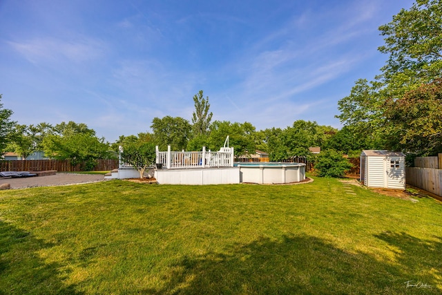 24147 S Sunset Dr, Channahon, IL 60410 - fenced backyard featuring a shed, an outdoor pool, and a deck