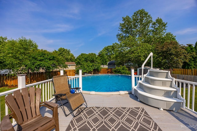 24147 S Sunset Dr, Channahon, IL 60410 - view of swimming pool with a wooden deck and a fenced backyard
