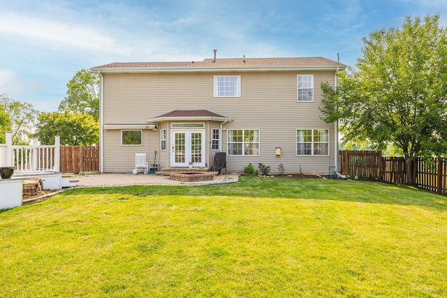 24147 S Sunset Dr, Channahon, IL 60410 - back of house with a patio, a fenced backyard, and french doors