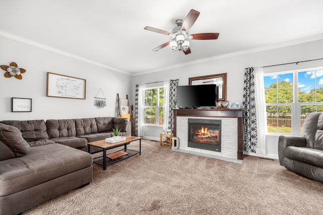 24147 S Sunset Dr, Channahon, IL 60410 - carpeted living room with ornamental molding, a brick fireplace, and a ceiling fan