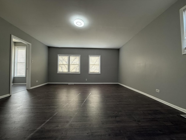 11258 S Church St, Chicago, IL 60643 - spare room featuring plenty of natural light, dark wood-type flooring, and baseboards
