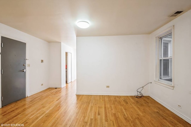238 W 31st St Unit 2W, Chicago, IL 60616 - unfurnished room with light wood-style flooring and baseboards