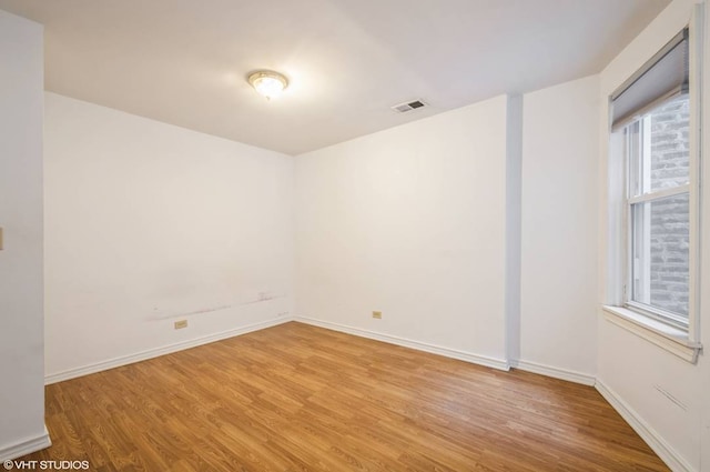 238 W 31st St Unit 2W, Chicago, IL 60616 - spare room with wood finished floors and baseboards