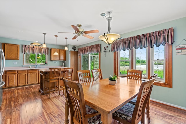 7 Farmington Ct, Lake In The Hills, IL 60156 - dining room with hardwood / wood-style floors, ceiling fan, and baseboards