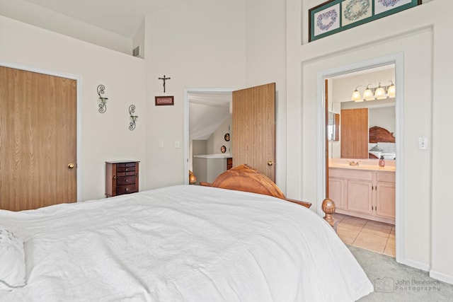 7 Farmington Ct, Lake In The Hills, IL 60156 - bedroom with high vaulted ceiling, a sink, light carpet, ensuite bathroom, and light tile patterned floors