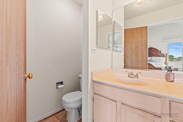 7 Farmington Ct, Lake In The Hills, IL 60156 - bathroom with toilet, tile patterned floors, vanity, and baseboards